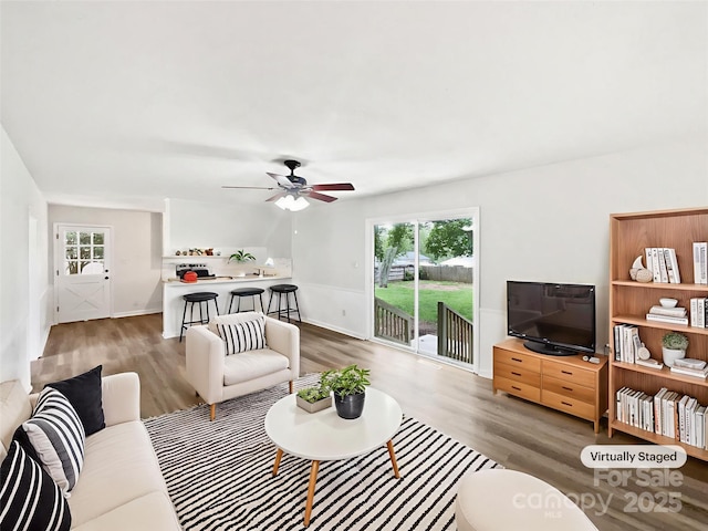 1224 Bethlehem Rd, Kings Mountain, NC 28086 - living room featuring wood finished floors, plenty of natural light, a ceiling fan, and baseboards