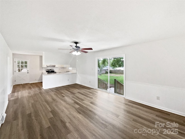 1224 Bethlehem Rd, Kings Mountain, NC 28086 - unfurnished living room with dark wood-style floors, ceiling fan, a sink, and baseboards