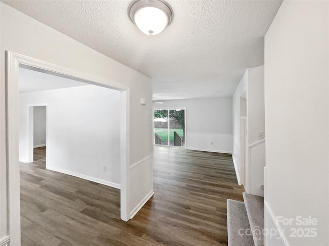 1224 Bethlehem Rd, Kings Mountain, NC 28086 - hall with dark wood finished floors, a textured ceiling, and baseboards