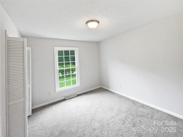 1224 Bethlehem Rd, Kings Mountain, NC 28086 - unfurnished bedroom featuring carpet, baseboards, and a textured ceiling