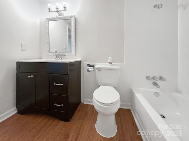 1224 Bethlehem Rd, Kings Mountain, NC 28086 - full bathroom with wood finished floors, vanity, toilet, and tile walls