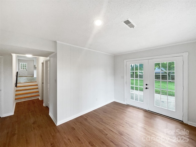 1224 Bethlehem Rd, Kings Mountain, NC 28086 - spare room with wood finished floors, french doors, baseboards, a textured ceiling, and stairway