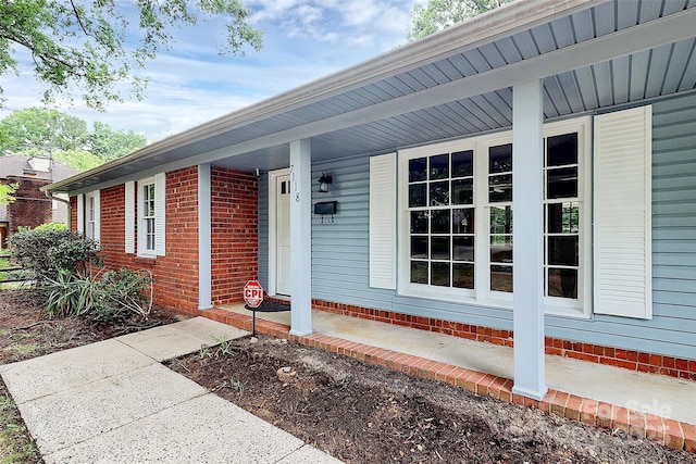 7118 April Ridge Ln, Charlotte, NC 28215 - entrance to property with covered porch and brick siding