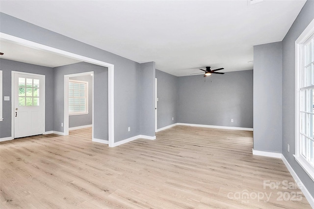 7118 April Ridge Ln, Charlotte, NC 28215 - spare room featuring a ceiling fan, baseboards, and light wood finished floors