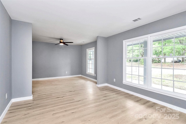 7118 April Ridge Ln, Charlotte, NC 28215 - empty room featuring baseboards, light wood finished floors, and a ceiling fan