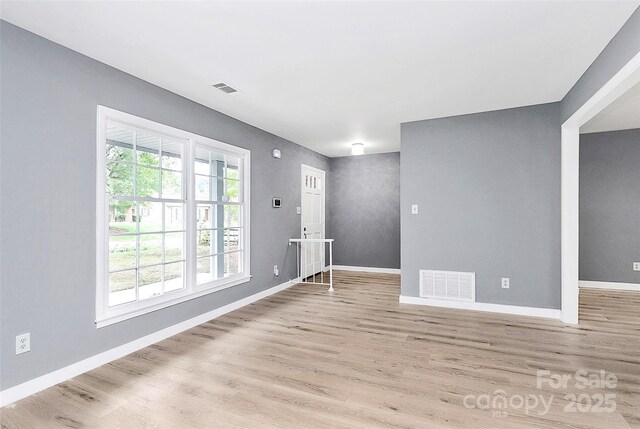 7118 April Ridge Ln, Charlotte, NC 28215 - unfurnished room featuring wood finished floors and baseboards