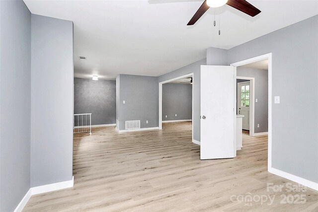 7118 April Ridge Ln, Charlotte, NC 28215 - spare room with a ceiling fan, light wood-style flooring, and baseboards