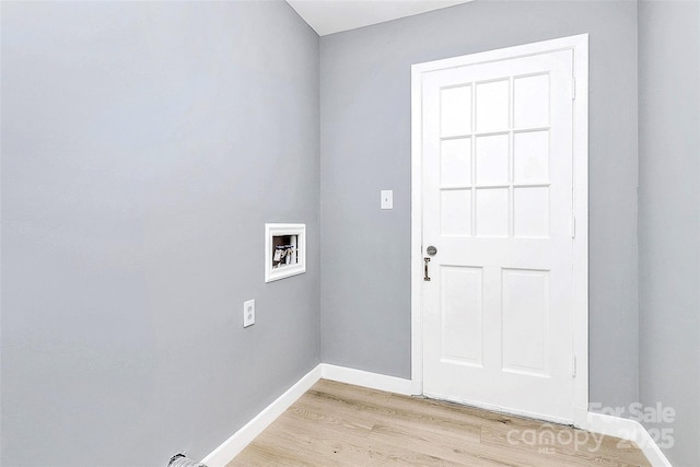 7118 April Ridge Ln, Charlotte, NC 28215 - laundry area with hookup for a washing machine, light wood-style flooring, and baseboards