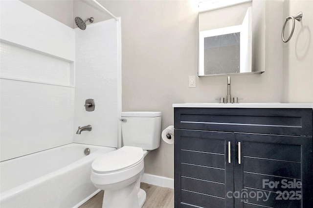 7118 April Ridge Ln, Charlotte, NC 28215 - full bathroom with wood finished floors, toilet, bathing tub / shower combination, vanity, and baseboards