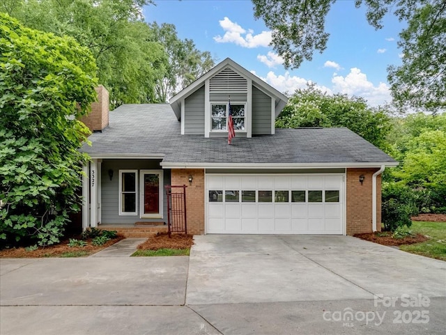 3327 Archdale Dr, Charlotte, NC 28210 - view of front of house featuring brick siding, a chimney, driveway, and an attached garage