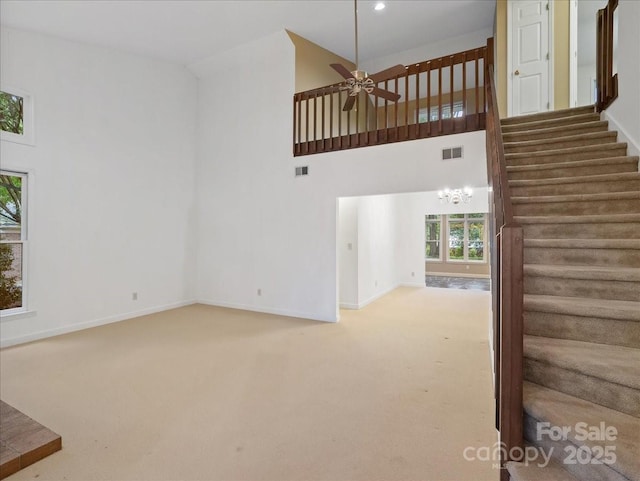 3327 Archdale Dr, Charlotte, NC 28210 - staircase featuring a towering ceiling, carpet flooring, baseboards, a ceiling fan, and recessed lighting