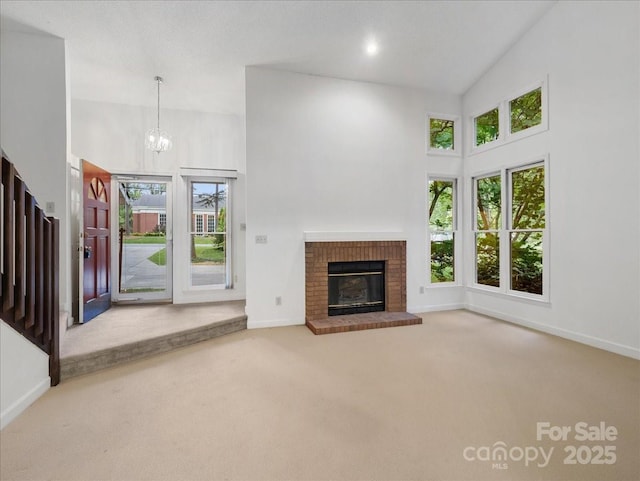3327 Archdale Dr, Charlotte, NC 28210 - unfurnished living room with carpet flooring, plenty of natural light, baseboards, and a towering ceiling