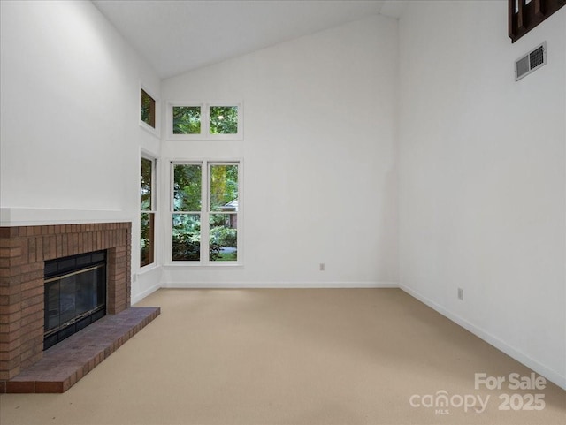 3327 Archdale Dr, Charlotte, NC 28210 - unfurnished living room featuring high vaulted ceiling, carpet flooring, a brick fireplace, and baseboards