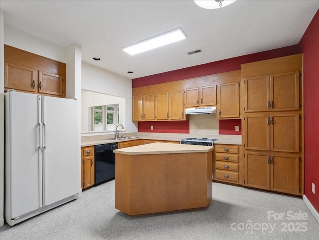 3327 Archdale Dr, Charlotte, NC 28210 - kitchen with freestanding refrigerator, dishwasher, under cabinet range hood, a sink, and light countertops