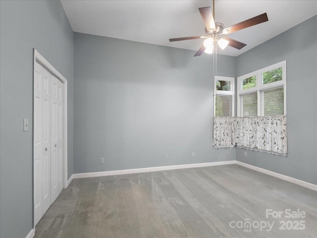 3327 Archdale Dr, Charlotte, NC 28210 - unfurnished bedroom with carpet flooring, baseboards, a closet, and a ceiling fan
