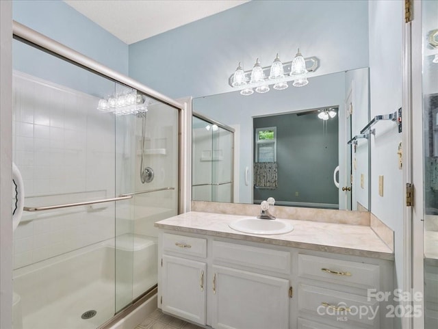 3327 Archdale Dr, Charlotte, NC 28210 - bathroom with a stall shower, vanity, and a ceiling fan