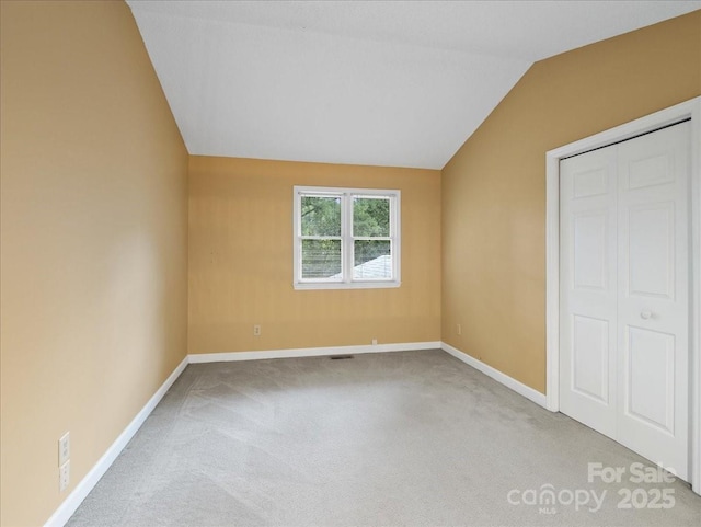 3327 Archdale Dr, Charlotte, NC 28210 - unfurnished bedroom with carpet floors, lofted ceiling, and baseboards