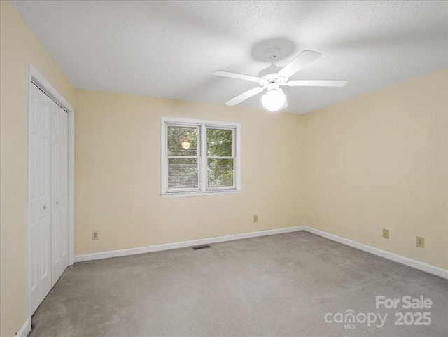3327 Archdale Dr, Charlotte, NC 28210 - unfurnished bedroom with carpet, a textured ceiling, a closet, baseboards, and ceiling fan