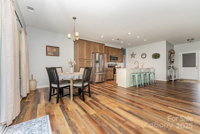 2705 Enon Church Rd, Salisbury, NC 28147 - dining space featuring dark wood-style floors, recessed lighting, baseboards, and a chandelier