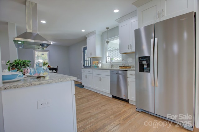 8607 Larchmont Cir, Charlotte, NC 28214 - kitchen with stainless steel appliances, island range hood, light wood finished floors, white cabinetry, and recessed lighting