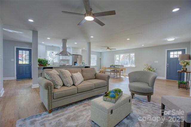 8607 Larchmont Cir, Charlotte, NC 28214 - living room with ceiling fan, baseboards, light wood finished floors, healthy amount of natural light, and recessed lighting