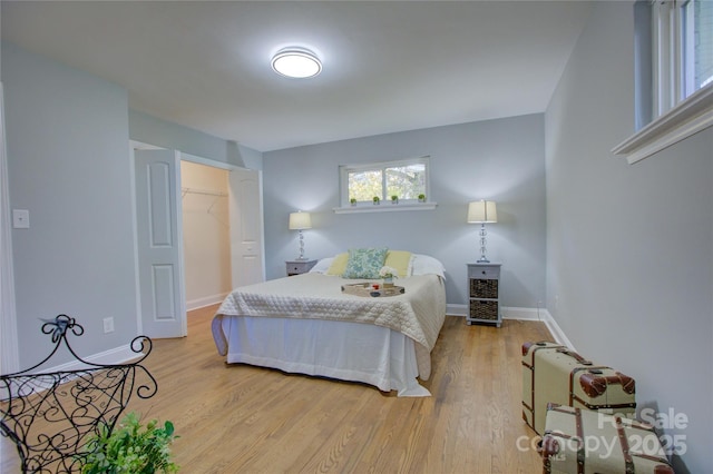 8607 Larchmont Cir, Charlotte, NC 28214 - bedroom with light wood-style flooring and baseboards
