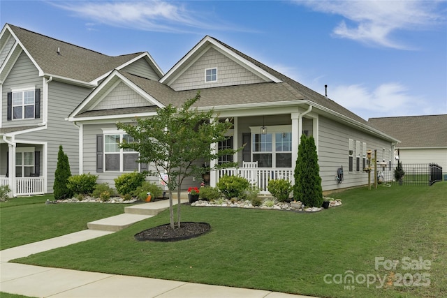 148 Kerri Dawn Ln, Locust, NC 28097 - view of front facade featuring a shingled roof and covered porch