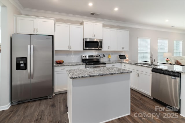 148 Kerri Dawn Ln, Locust, NC 28097 - kitchen with appliances with stainless steel finishes, a sink, crown molding, white cabinets, and recessed lighting