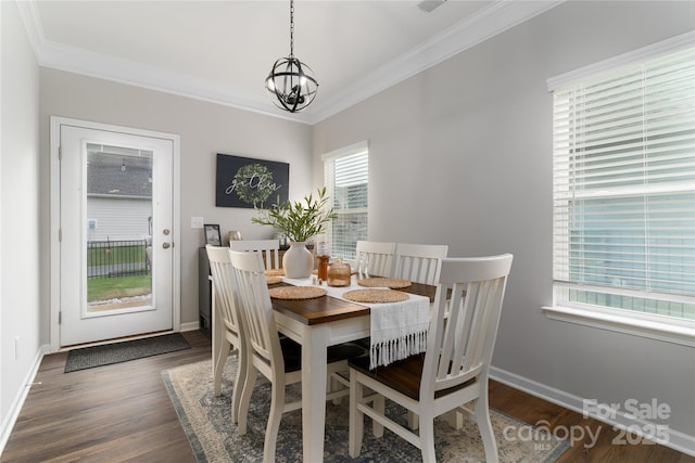 148 Kerri Dawn Ln, Locust, NC 28097 - dining room with a chandelier, ornamental molding, wood finished floors, and baseboards
