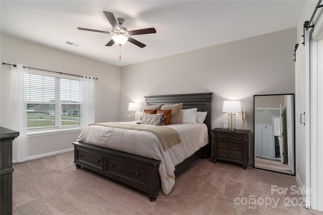 148 Kerri Dawn Ln, Locust, NC 28097 - bedroom with a barn door, light carpet, baseboards, and a ceiling fan