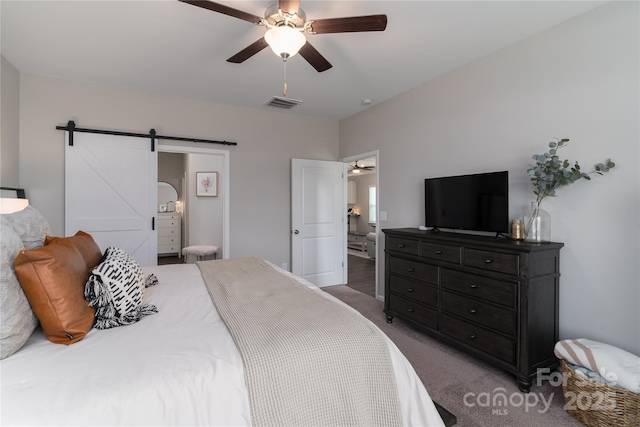 148 Kerri Dawn Ln, Locust, NC 28097 - bedroom with a barn door, carpet flooring, and ceiling fan