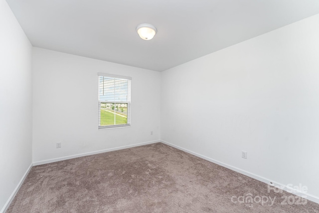 3077 Light Ridge Ct SW, Concord, NC 28027 - carpeted spare room with baseboards
