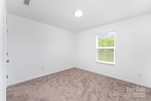3077 Light Ridge Ct SW, Concord, NC 28027 - spare room featuring carpet flooring and baseboards