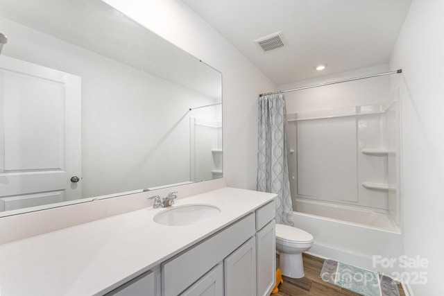 3077 Light Ridge Ct SW, Concord, NC 28027 - bathroom featuring vanity, toilet, wood finished floors, shower / tub combo with curtain, and recessed lighting