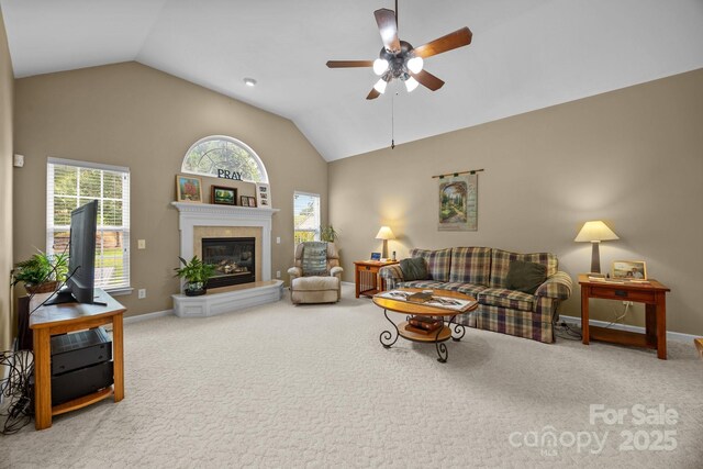 6533 Derby Ln NW, Concord, NC 28027 - living room featuring vaulted ceiling, a ceiling fan, carpet flooring, a tiled fireplace, and baseboards