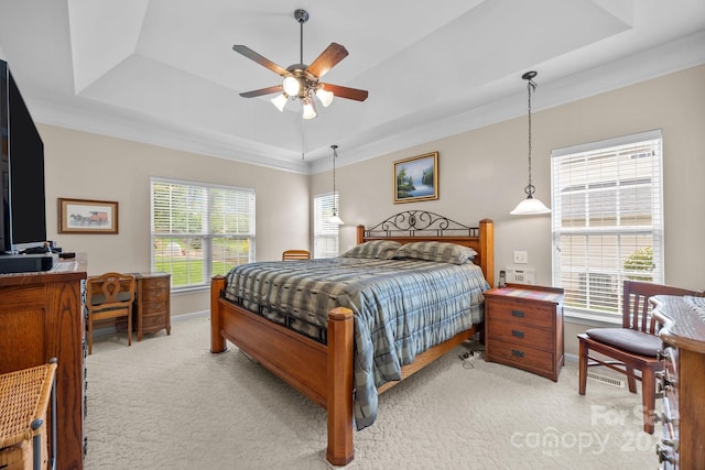 6533 Derby Ln NW, Concord, NC 28027 - bedroom featuring a tray ceiling, light colored carpet, baseboards, ornamental molding, and ceiling fan