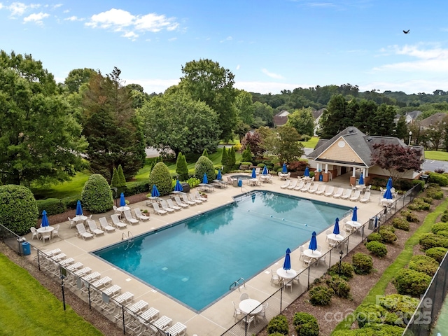 6533 Derby Ln NW, Concord, NC 28027 - community pool featuring a patio area and view of scattered trees