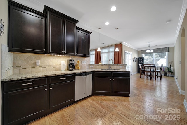 909 Autumn Glen Ct, Clover, SC 29710 - kitchen with dishwasher, a sink, light wood-type flooring, ornamental molding, and backsplash