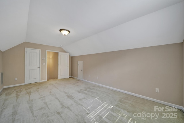 909 Autumn Glen Ct, Clover, SC 29710 - additional living space with vaulted ceiling, light colored carpet, and baseboards