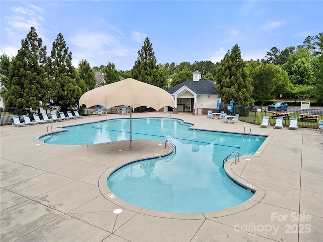 7130 Maricopa Rd, Charlotte, NC 28277 - community pool featuring a patio area, view of scattered trees, and an outbuilding