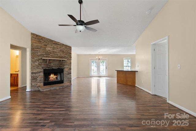 116 Dean Rd, Anderson, SC 29625 - unfurnished living room with a ceiling fan, dark wood-type flooring, a fireplace, a chandelier, and high vaulted ceiling