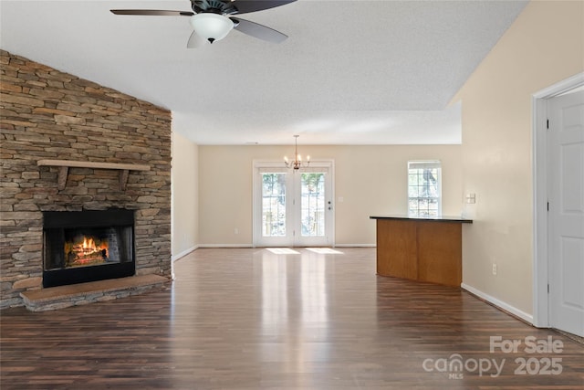 116 Dean Rd, Anderson, SC 29625 - unfurnished living room featuring wood finished floors, a ceiling fan, baseboards, a fireplace, and a textured ceiling