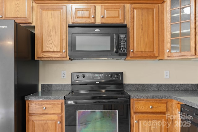 116 Dean Rd, Anderson, SC 29625 - kitchen featuring black appliances, glass insert cabinets, and dark countertops