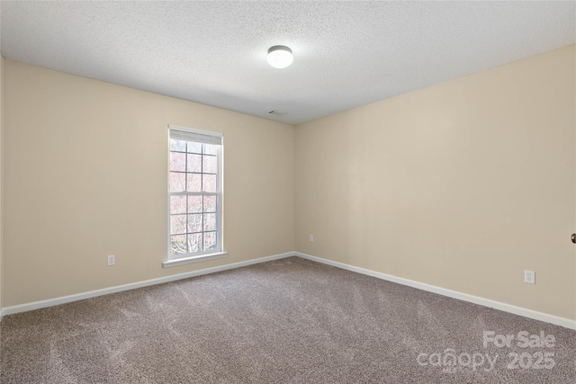 116 Dean Rd, Anderson, SC 29625 - carpeted spare room with baseboards and a textured ceiling
