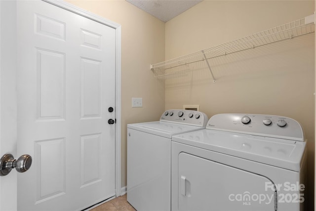 116 Dean Rd, Anderson, SC 29625 - laundry room featuring separate washer and dryer and light tile patterned flooring