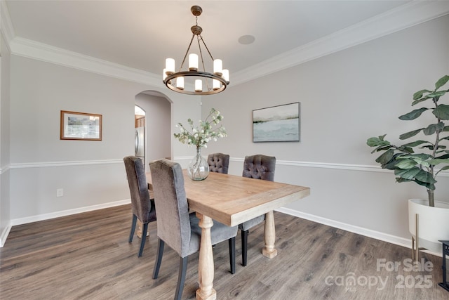 424 Castlebury Ct, Clover, SC 29710 - dining space featuring arched walkways, wood finished floors, baseboards, and ornamental molding