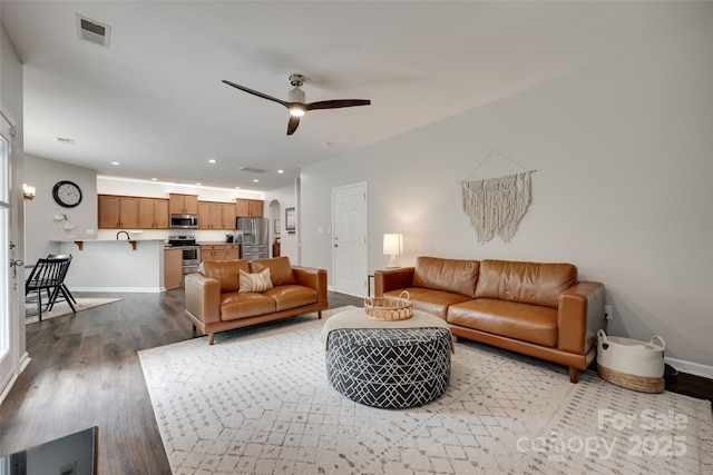 424 Castlebury Ct, Clover, SC 29710 - living area featuring wood finished floors, arched walkways, baseboards, ceiling fan, and recessed lighting