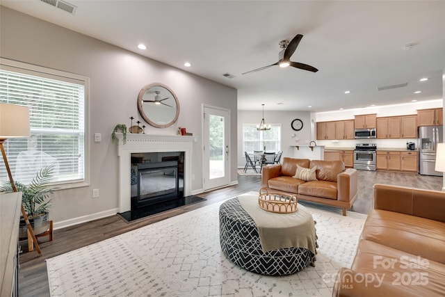 424 Castlebury Ct, Clover, SC 29710 - living area featuring recessed lighting, ceiling fan, wood finished floors, baseboards, and a glass covered fireplace