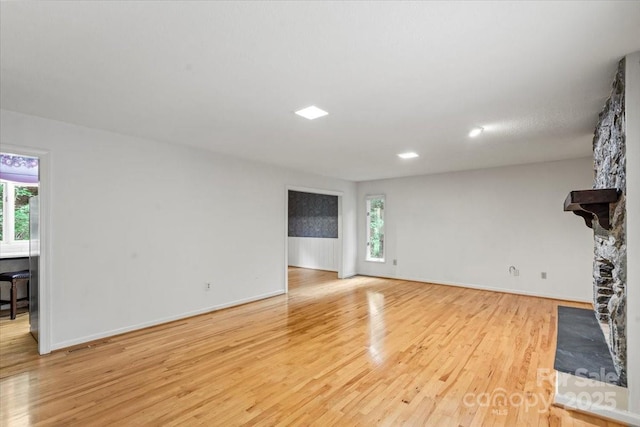 460 27th Avenue Cir NW, Hickory, NC 28601 - unfurnished living room with light wood-style flooring, plenty of natural light, baseboards, and recessed lighting