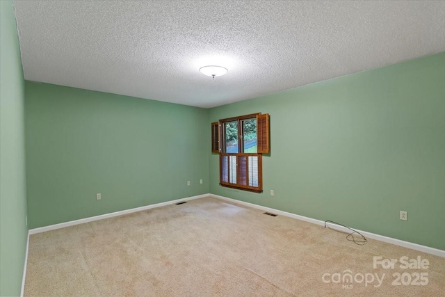 460 27th Avenue Cir NW, Hickory, NC 28601 - unfurnished room featuring carpet flooring, a textured ceiling, and baseboards